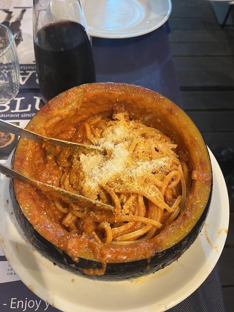 Authentic Roman amatriciana pasta served at a traditional fraschetta