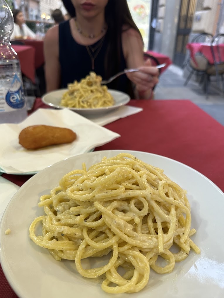 Traditional Roman cacio e pepe pasta served at a local restaurant