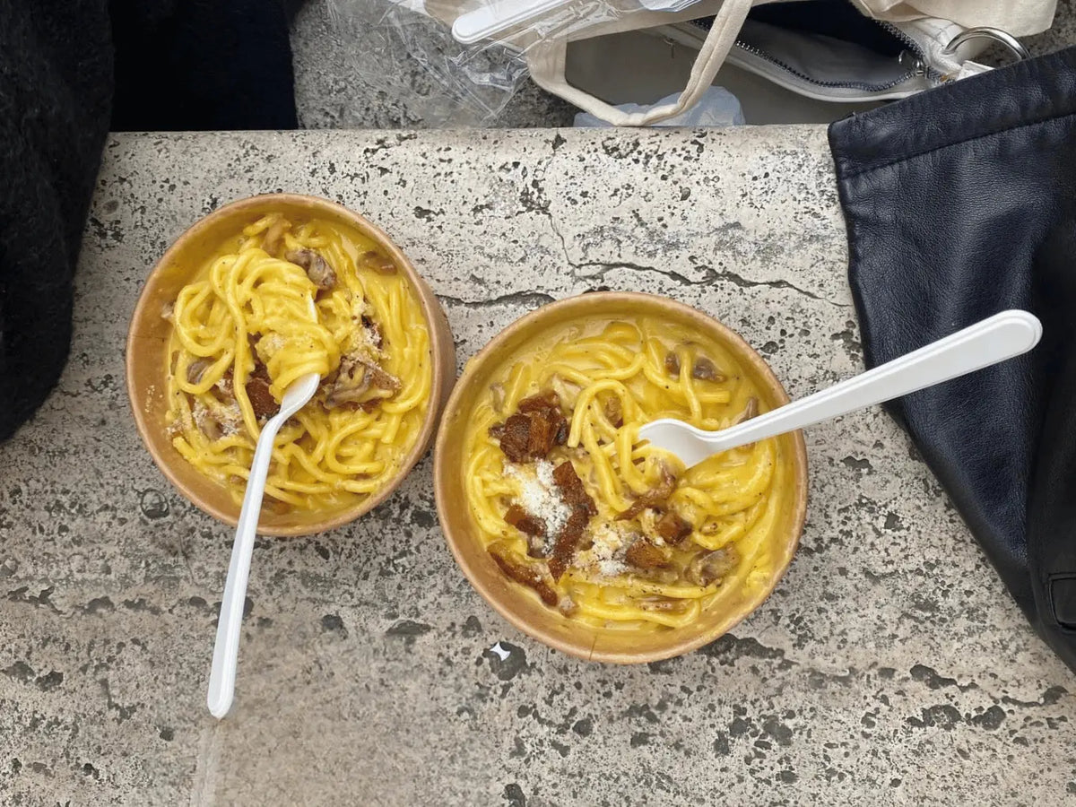 Traditional Roman pasta enjoyed during a casual lunch in Trastevere