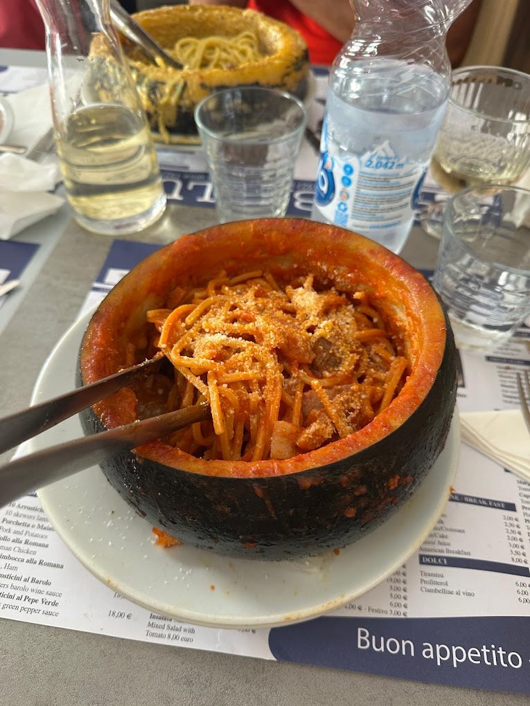 Roman amatriciana pasta served at a traditional fraschetta