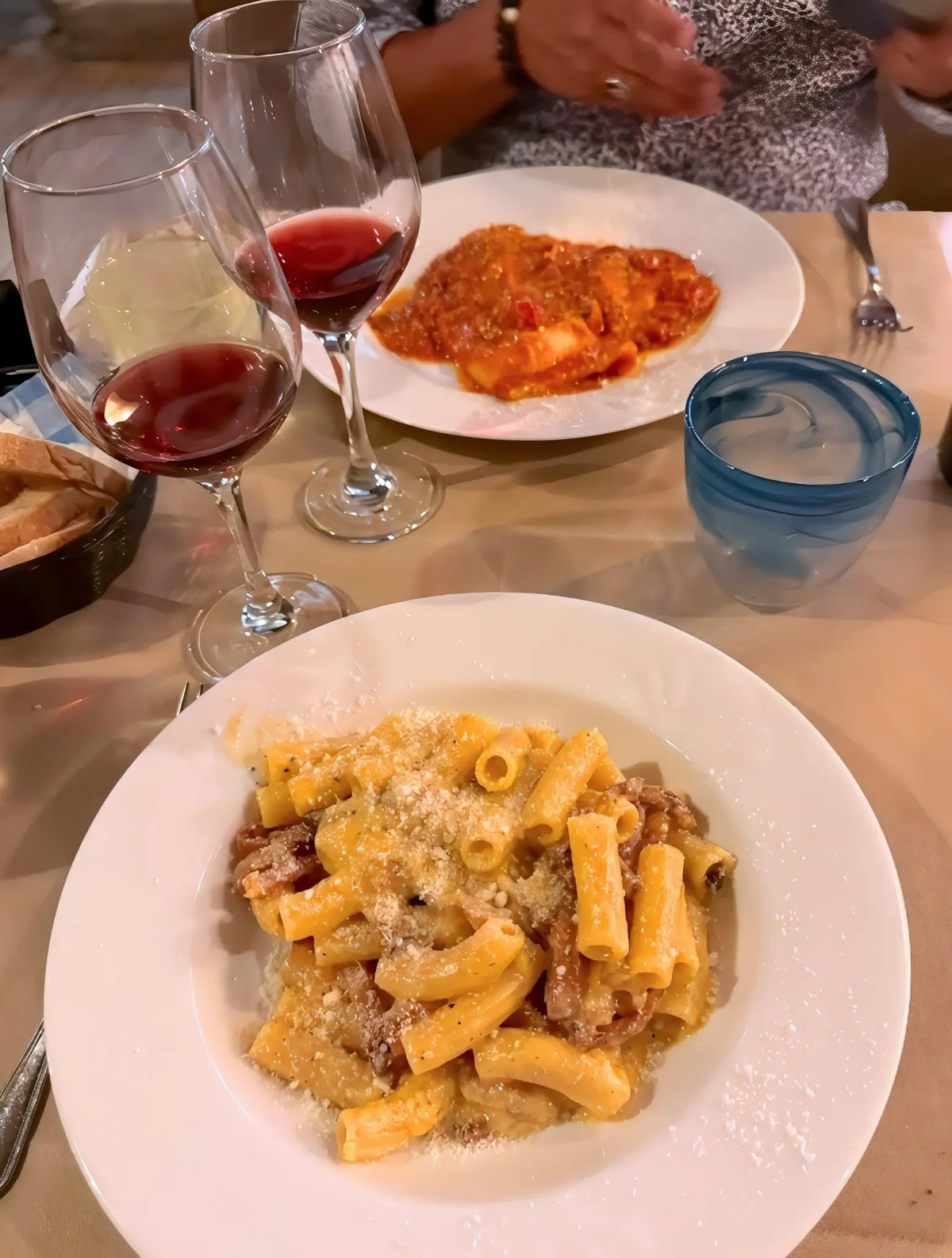 Traditional Roman pasta served with wine in Rome