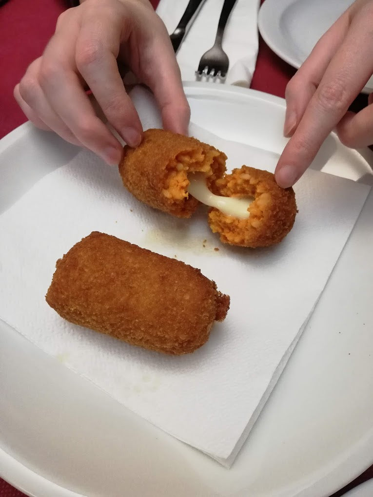 Traditional Roman supplì served as a street food appetizer