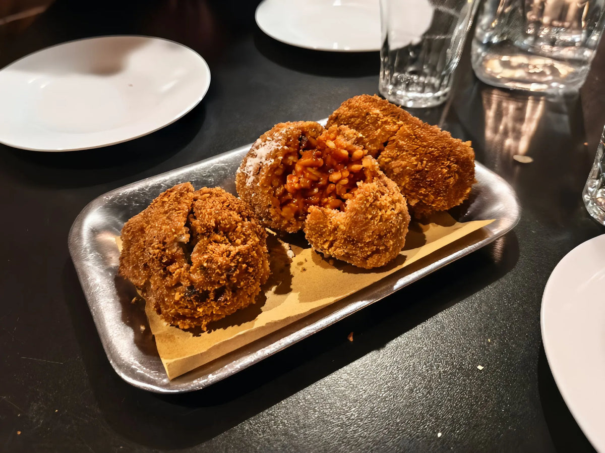 Traditional Roman supplì enjoyed during a food and nightlife experience