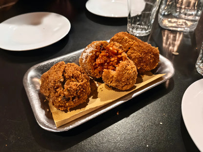 Traditional Roman supplì enjoyed during a food and nightlife experience